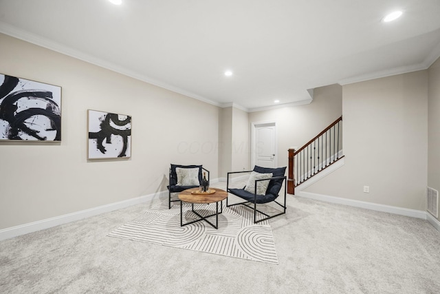 sitting room featuring stairway, carpet floors, ornamental molding, and recessed lighting