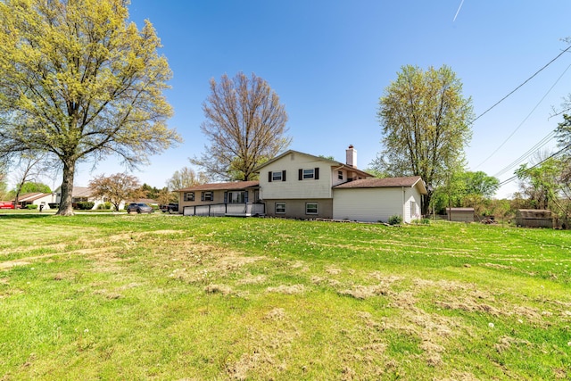 14 Stoney Ridge Dr SW, Pataskala, OH 43062 - back of house with a yard and a chimney