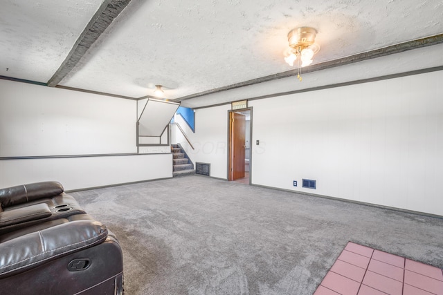 14 Stoney Ridge Dr SW, Pataskala, OH 43062 - unfurnished living room with visible vents, a textured ceiling, carpet, and stairway