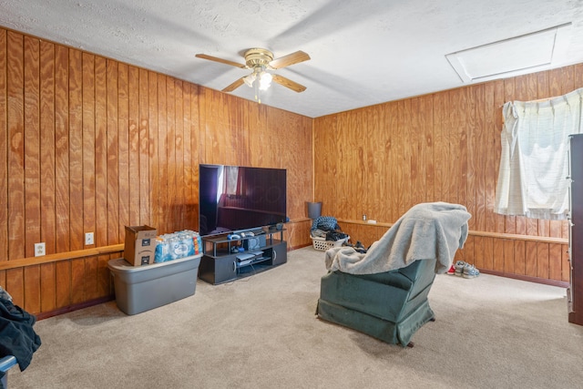 14 Stoney Ridge Dr SW, Pataskala, OH 43062 - carpeted living area featuring a ceiling fan, wood walls, and attic access