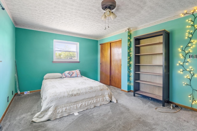 14 Stoney Ridge Dr SW, Pataskala, OH 43062 - bedroom with a textured ceiling, ceiling fan, carpet, and a closet