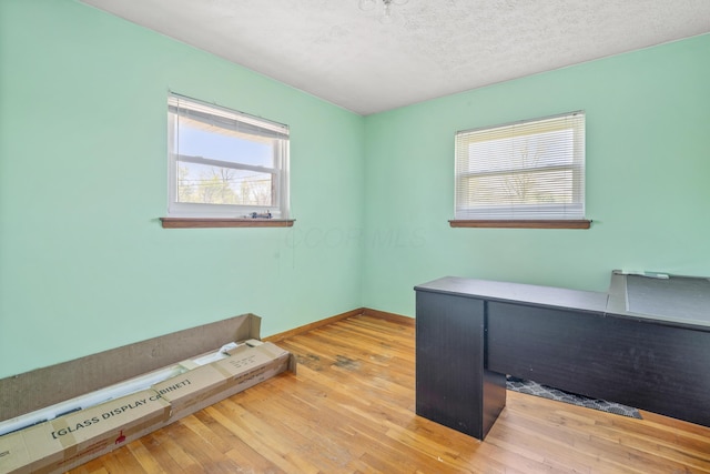 14 Stoney Ridge Dr SW, Pataskala, OH 43062 - unfurnished office featuring baseboards, a textured ceiling, and wood finished floors