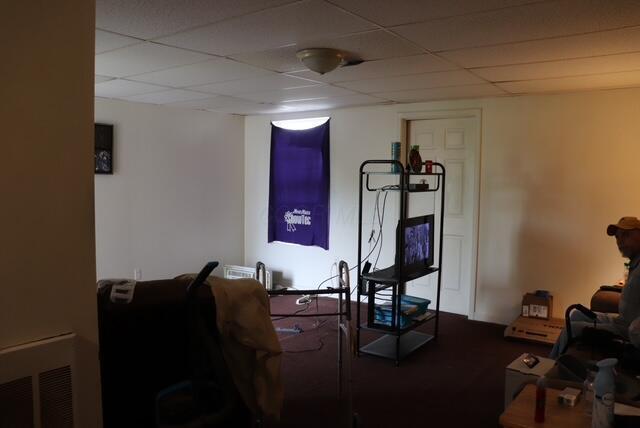 workout area with a paneled ceiling