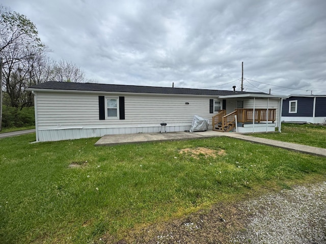 1049 Harmon Ave Unit C82, Columbus, OH 43223 - back of house featuring a lawn