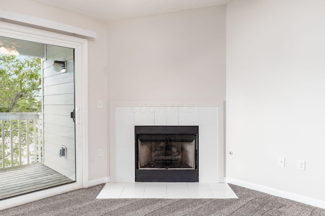 details featuring carpet flooring, baseboards, and a fireplace