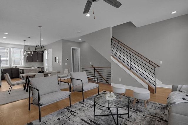 754 N 6th St, Columbus, OH 43215 - living room featuring recessed lighting, a ceiling fan, light wood-style flooring, and stairs