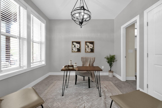 754 N 6th St, Columbus, OH 43215 - home office with an inviting chandelier, baseboards, plenty of natural light, and light colored carpet