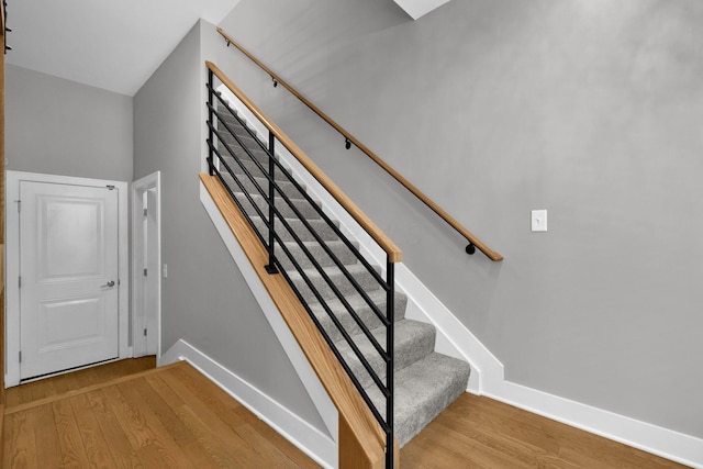 754 N 6th St, Columbus, OH 43215 - stairway with baseboards and wood finished floors