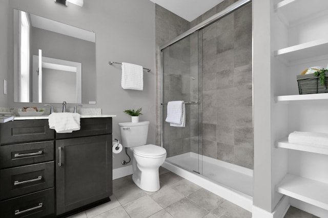 754 N 6th St, Columbus, OH 43215 - full bathroom featuring vanity, baseboards, a stall shower, and toilet