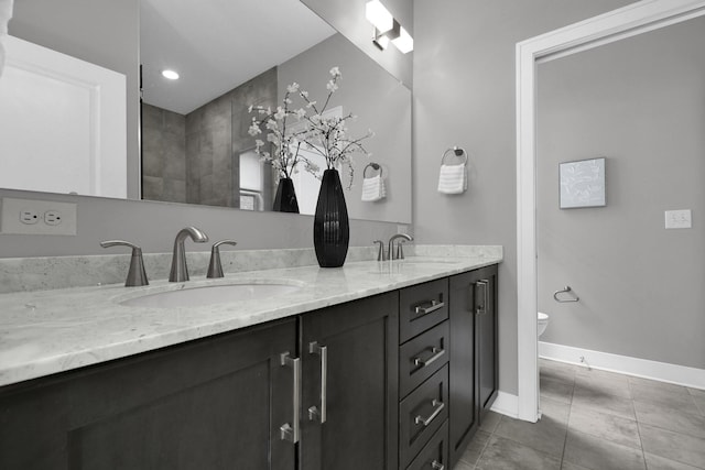 754 N 6th St, Columbus, OH 43215 - bathroom featuring double vanity, a sink, tile patterned floors, and toilet