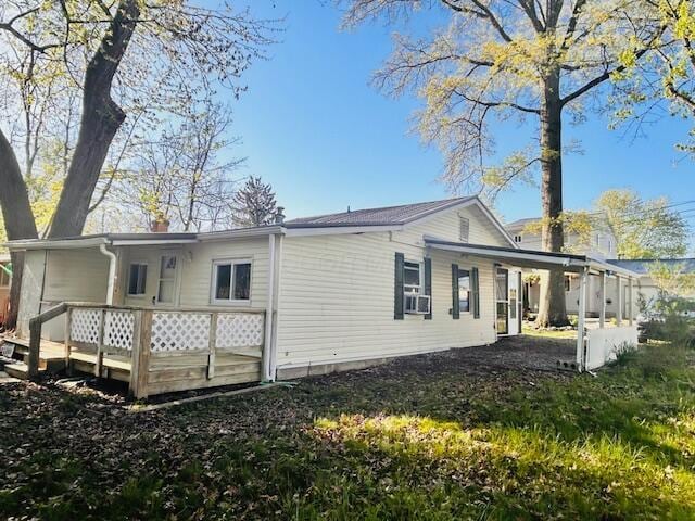485 Union Ave, Buckeye Lake, OH 43008 - back of house featuring a chimney, a wooden deck, and cooling unit