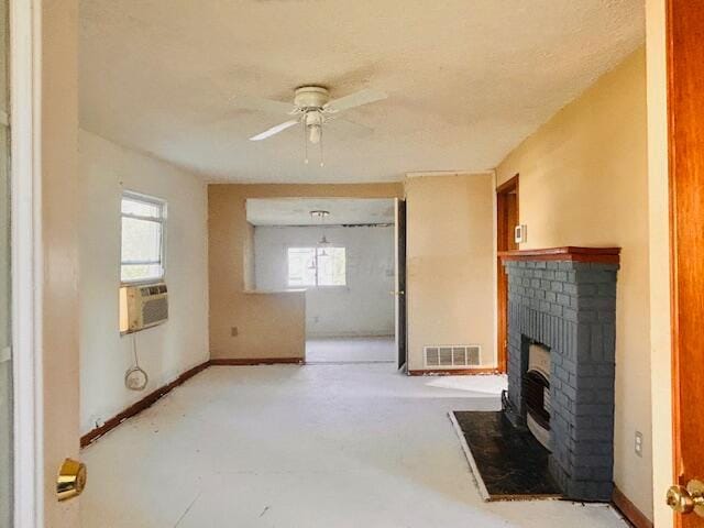485 Union Ave, Buckeye Lake, OH 43008 - unfurnished living room with visible vents, a ceiling fan, a fireplace, and plenty of natural light