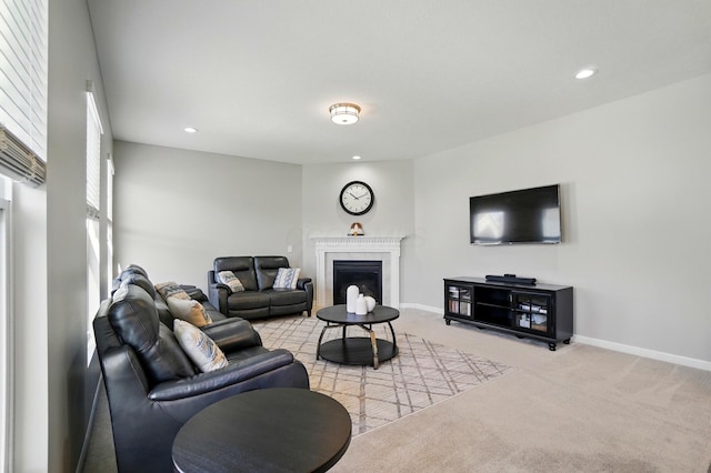 carpeted living room featuring recessed lighting, baseboards, and a fireplace