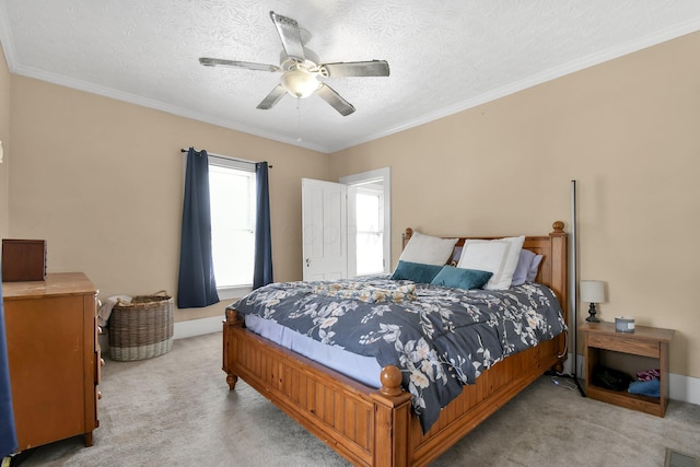 bedroom featuring ornamental molding, visible vents, ceiling fan, and light colored carpet