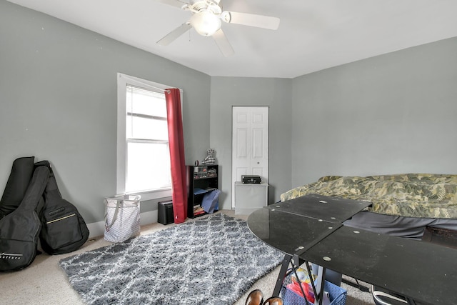 carpeted bedroom with a ceiling fan
