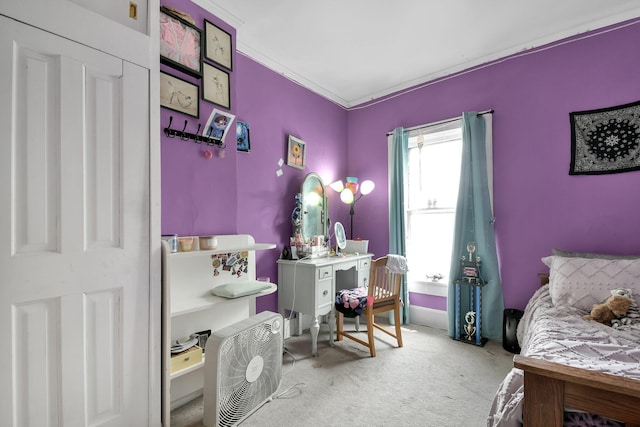 carpeted bedroom with ornamental molding