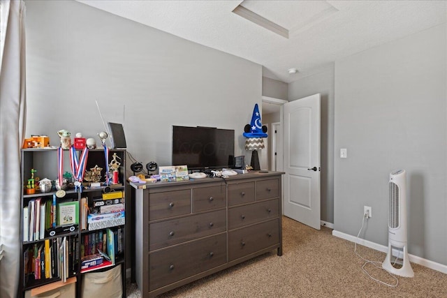 bedroom featuring baseboards and light carpet