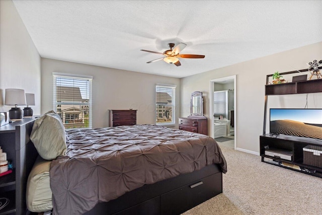 bedroom with a textured ceiling, ceiling fan, and light carpet
