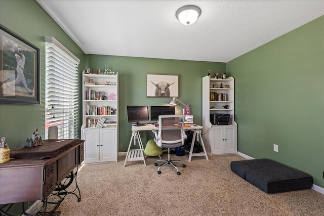 carpeted office space with baseboards