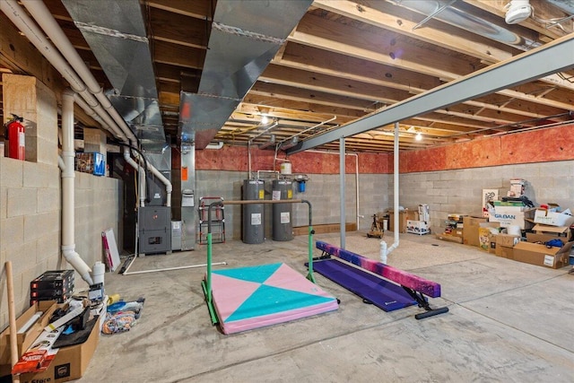 unfinished below grade area featuring heating unit and electric water heater