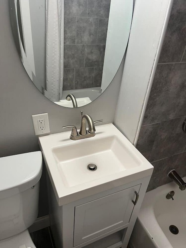 full bath featuring toilet and vanity
