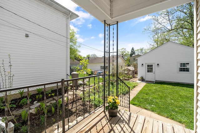 wooden deck featuring a yard