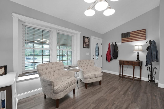 living area featuring dark wood-type flooring, baseboards, and vaulted ceiling