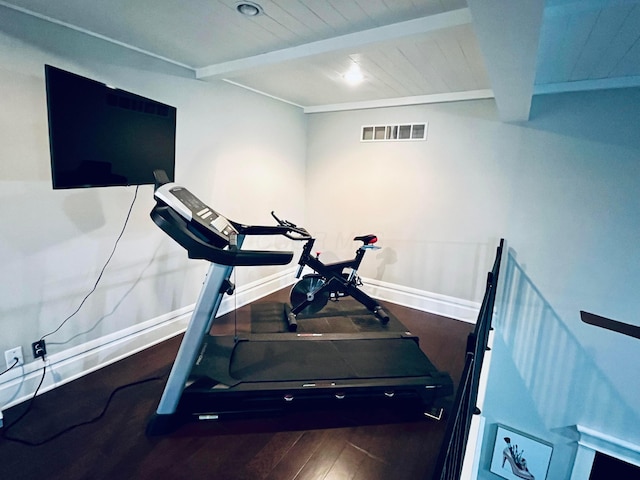 workout room featuring wood ceiling, baseboards, visible vents, and wood finished floors