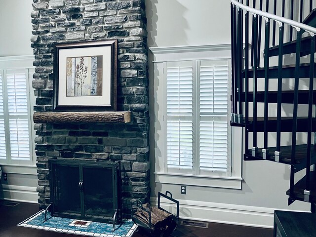 details with visible vents and a fireplace