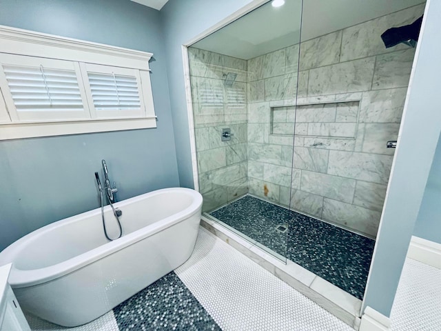 bathroom featuring a walk in shower and a soaking tub