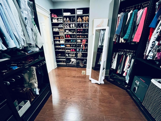 spacious closet featuring wood finished floors