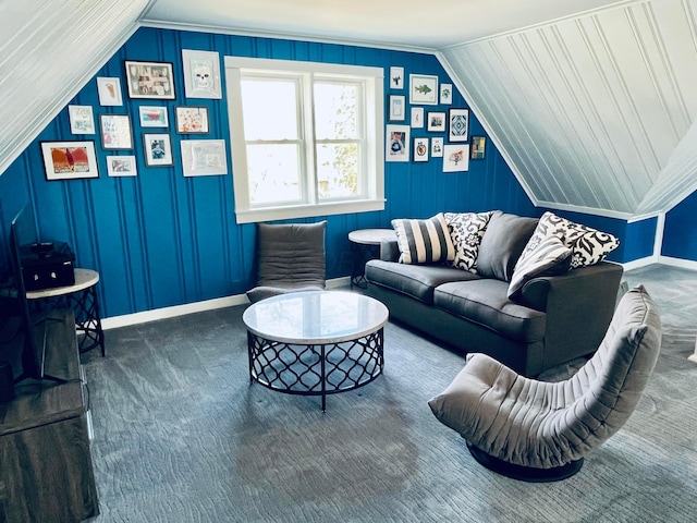 carpeted living room with baseboards and vaulted ceiling