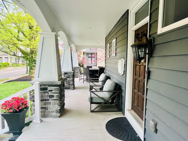 wooden deck featuring covered porch
