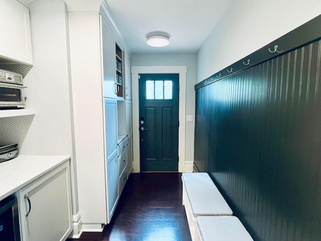 entryway featuring dark wood-type flooring