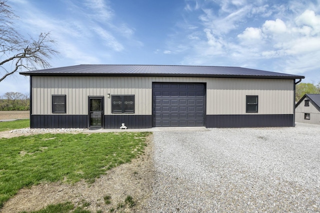 view of outbuilding featuring an outdoor structure and gravel driveway