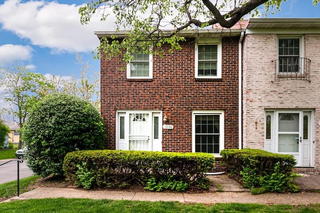 multi unit property featuring brick siding