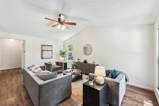 3186 Bowdoin Cir, Columbus, OH 43204 - living room featuring ceiling fan, wood finished floors, lofted ceiling, and baseboards