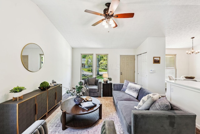 3186 Bowdoin Cir, Columbus, OH 43204 - living area with ceiling fan, a chandelier, and lofted ceiling