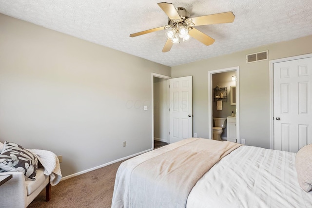3186 Bowdoin Cir, Columbus, OH 43204 - carpeted bedroom featuring a textured ceiling, baseboards, ensuite bathroom, and ceiling fan