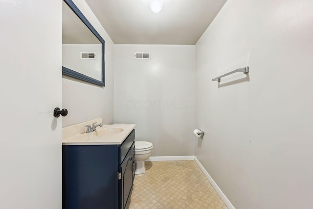 3186 Bowdoin Cir, Columbus, OH 43204 - bathroom with toilet, tile patterned floors, vanity, and baseboards