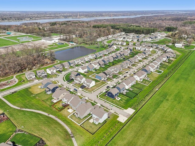 bird's eye view with a residential view and a water view