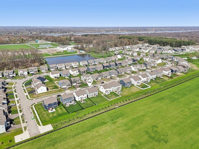 bird's eye view with a residential view and a water view