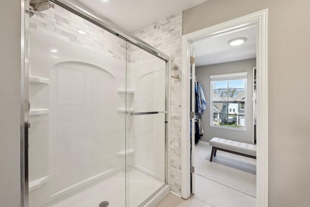 full bath featuring a shower stall