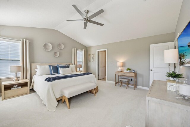 bedroom with baseboards, ceiling fan, vaulted ceiling, and light carpet