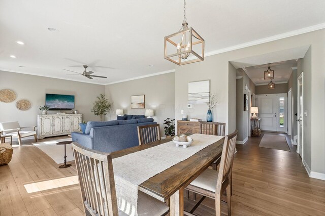 dining area featuring crown molding and wood finished floors