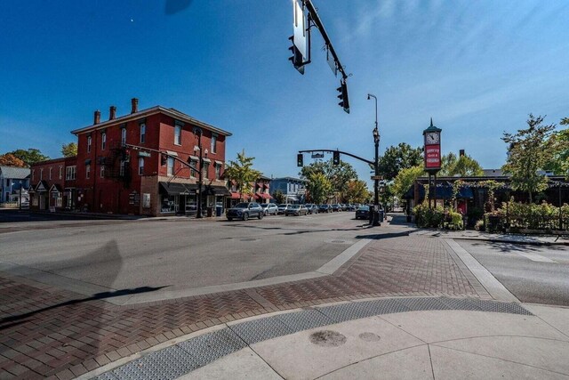view of street with street lighting, curbs, and sidewalks