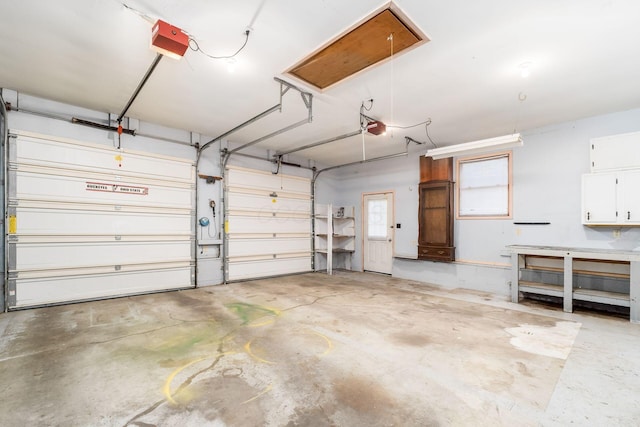 garage featuring a garage door opener