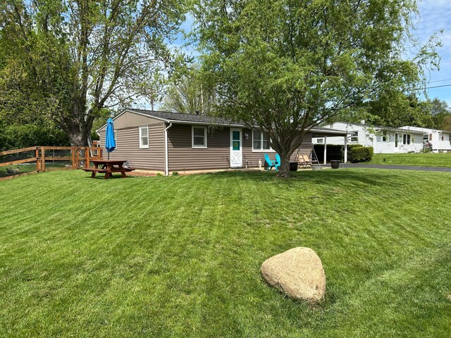 view of front of property with fence and a front yard