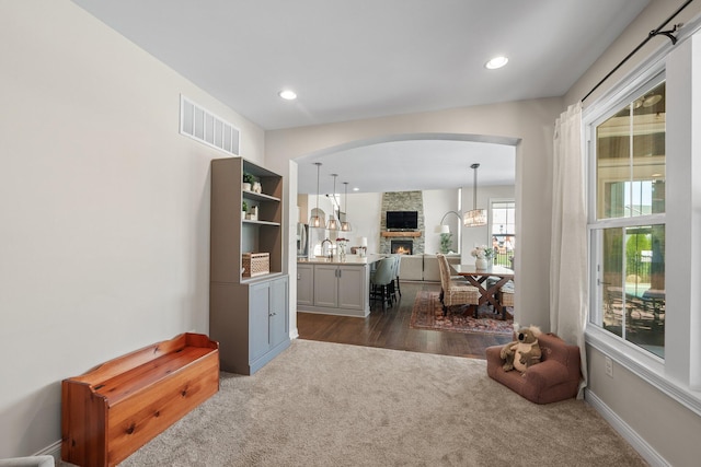 8153 Lilium Way, Plain City, OH 43064 - interior space featuring recessed lighting, arched walkways, visible vents, and dark carpet