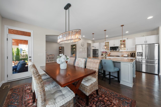 8153 Lilium Way, Plain City, OH 43064 - dining room featuring a notable chandelier, recessed lighting, visible vents, and dark wood-type flooring